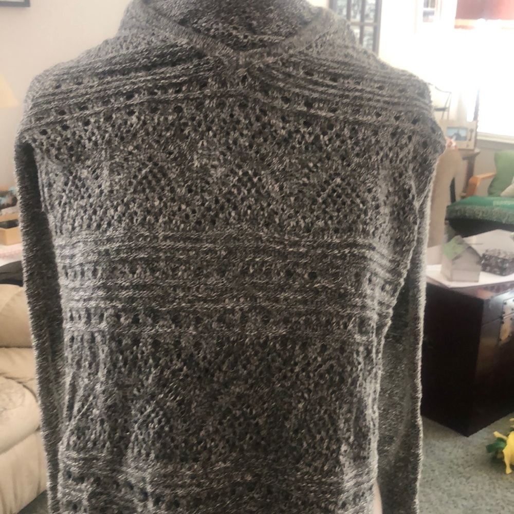 Green and whit knitted hooded sweater.